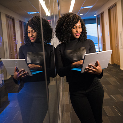A woman using a laptop.