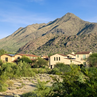 Luxury homes in front of a mountain in North Scottsdale's community of DC Ranch.