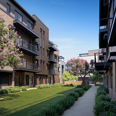 Rendering of Atavia luxury condo buildings featuring balconies. A landscaped courtyard with green grass, flowered trees, and shrubs is in the center. The sky is clear and blue.