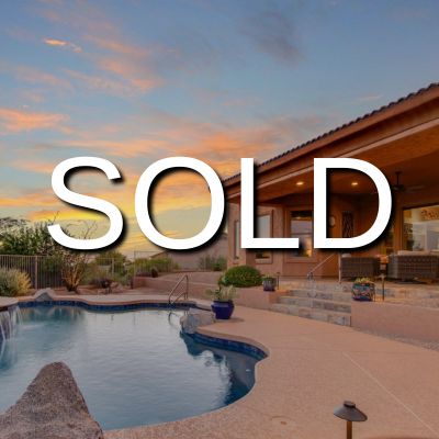 A "SOLD" sign overlay on an image of a luxury home with a pool and spacious patio, set against a colorful sunset sky.