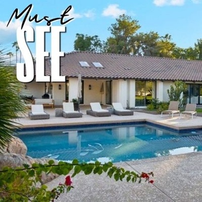 Backyard pool and lounge chairs of a luxury home in Paradise Valley, Arizona with the words "Must See" above it.