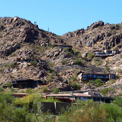 Hillside homes built into rugged desert mountains in Arizona.