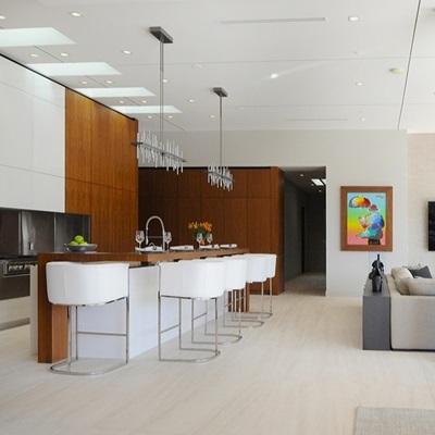 Spacious Scottsdale rental property with sleek open-concept living area, modern kitchen, and stylish bar seating.
