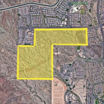 Map image showing a highlighted area of land in Peoria, Arizona. The highlighted portion is outlined in yellow and appears to encompass a section of desert terrain adjacent to established residential neighborhoods and Westland Park.