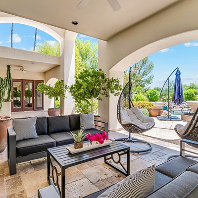 Backyard patio of an investment property in Arizona on a sunny blue-skied day.