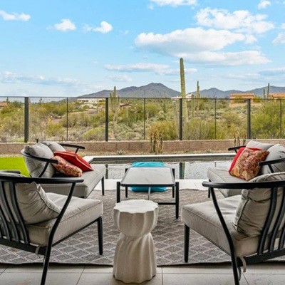 Blue sky with puffy clouds and a mountain in North Scottsdale.