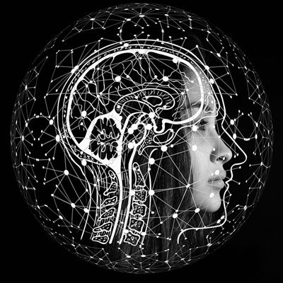 Silhouette of a woman’s profile overlaid with a white anatomical brain diagram and a network of glowing connections.