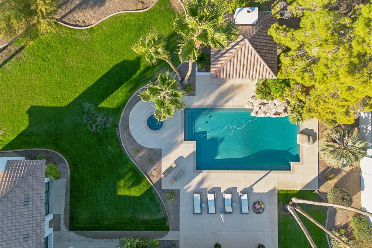 Aerial view of luxury home with a big pool in Paradise Valley