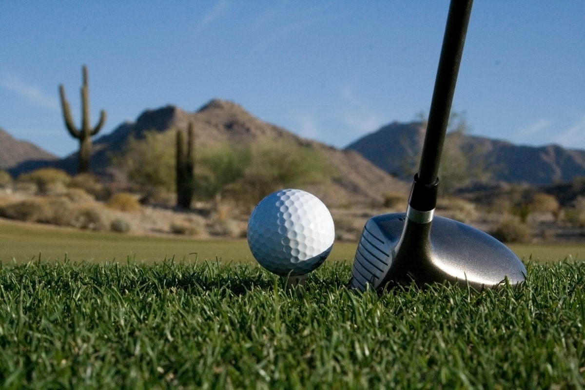 Club aimed to hit a golf ball on the course green