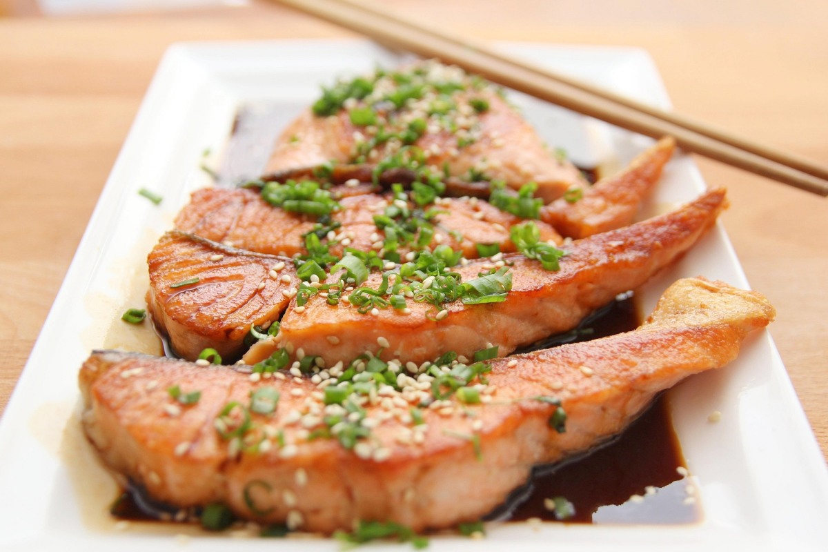 Salmon dish with greens on top