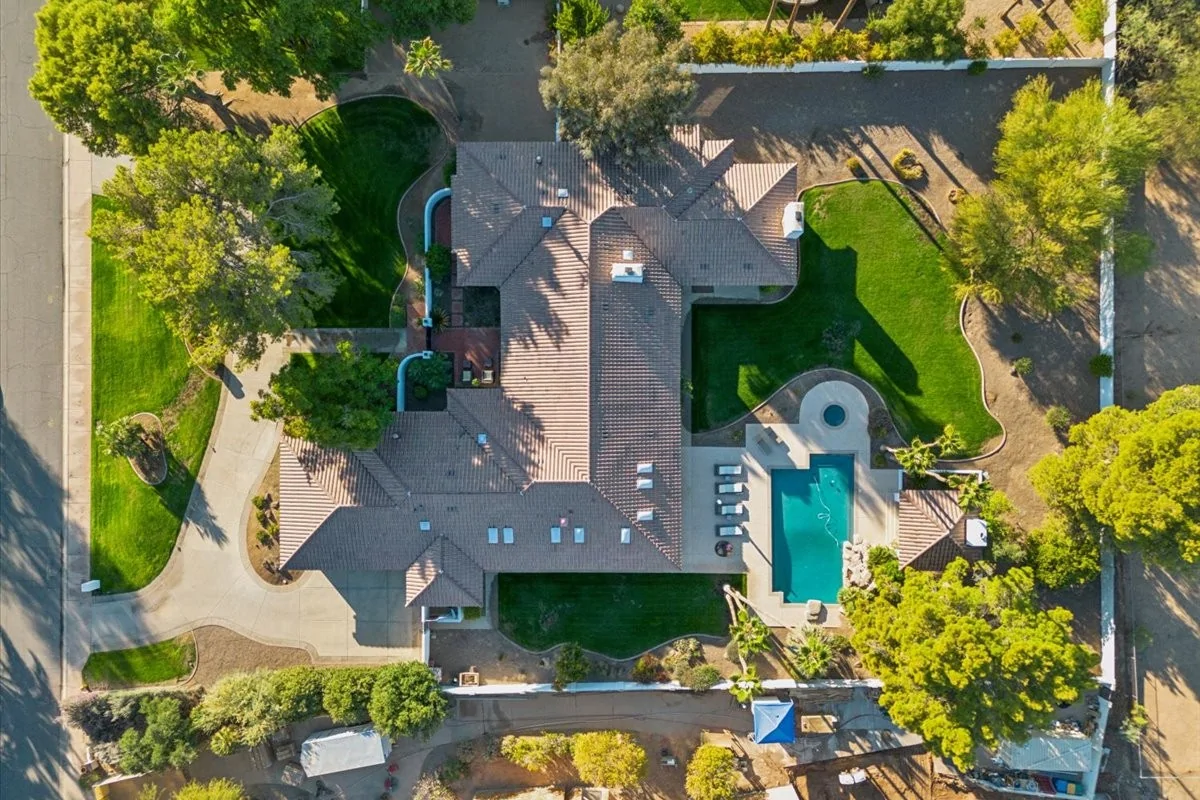 Aerial view of a Paradise Valley home with a pool and lots of greenery
