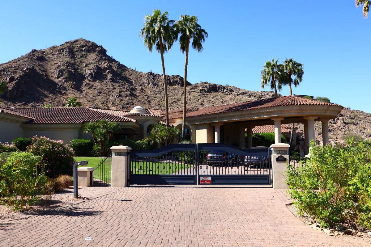 Paradise Valley home with palm trees and mountain backdrop