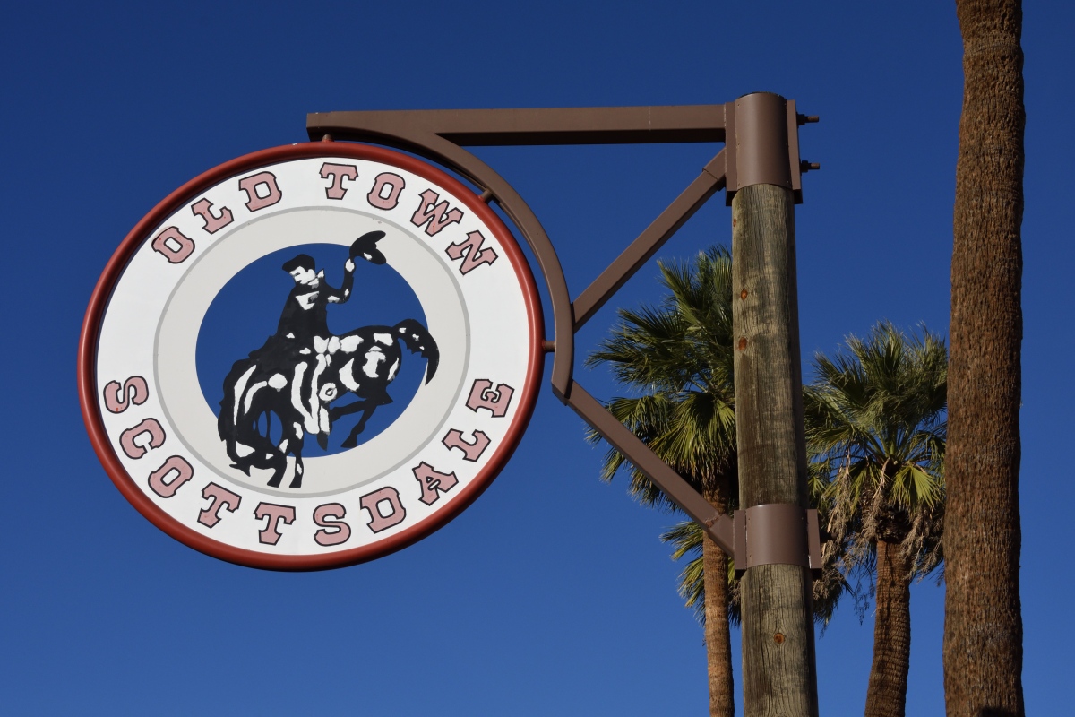 Closeup of Old Town Scottsdale sign against blue sky in Scottsdale, Arizona.
