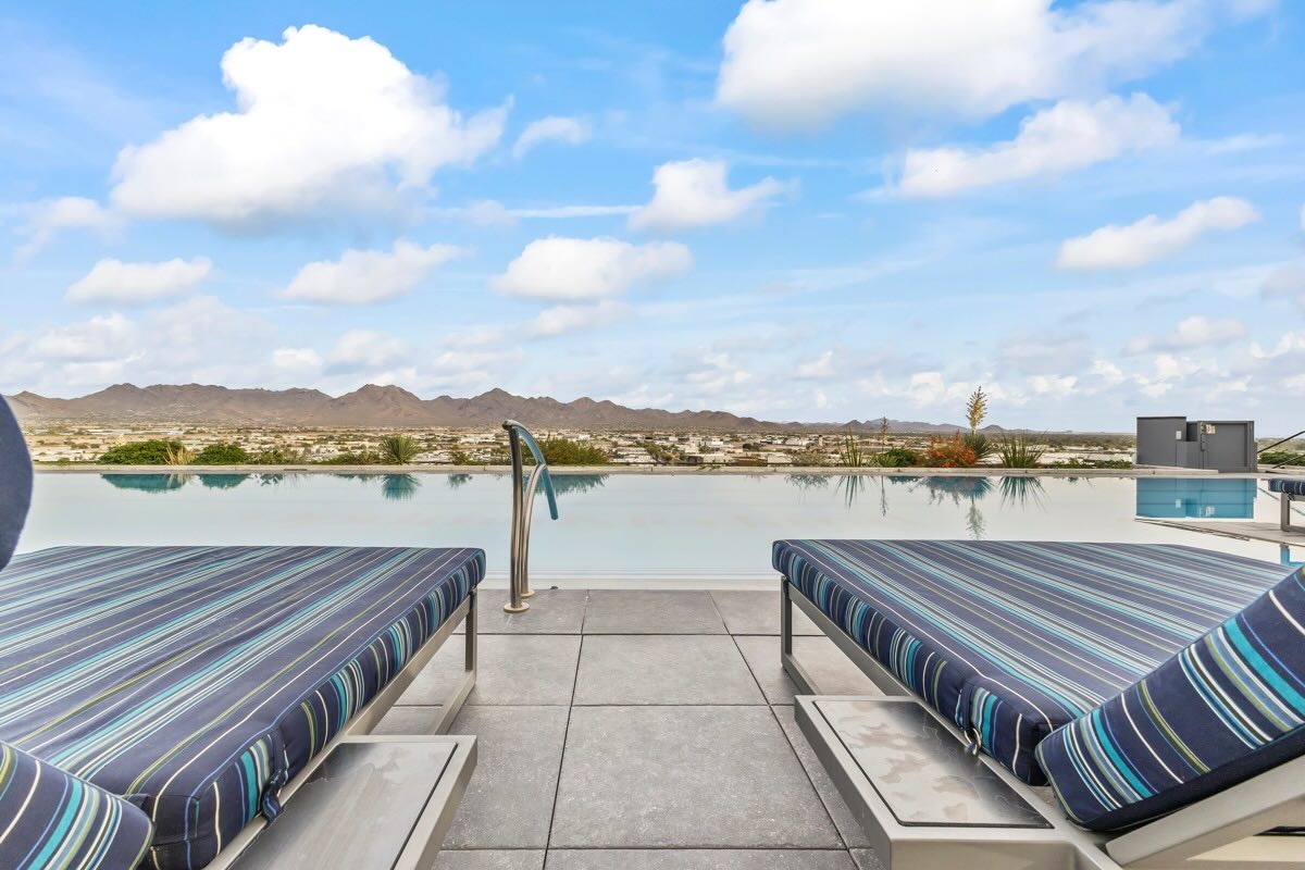 View of rooftop pool, lounge chairs, and Scottsdale
