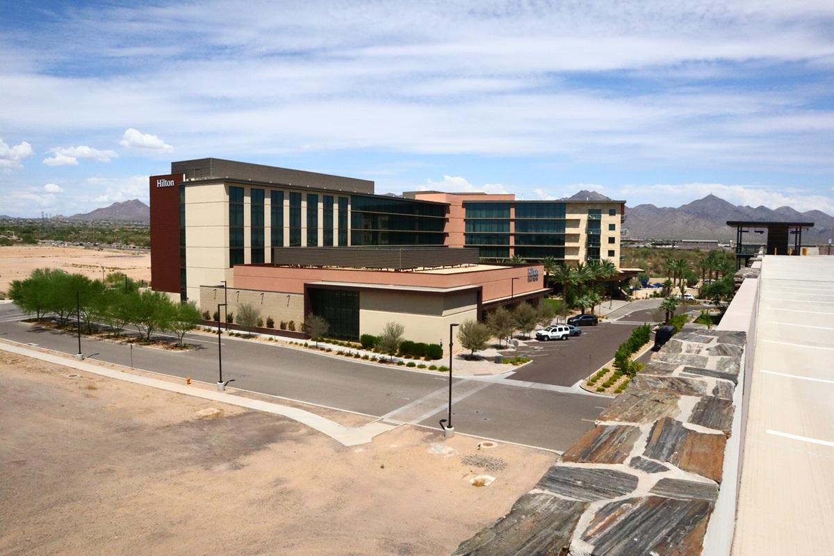 Hilton North Scottsdale at Cavasson with desert mountains in background.