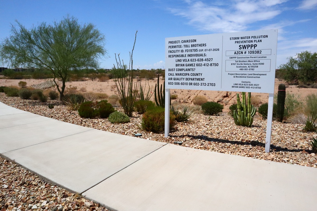 Project sign for Cavasson by Toll Brothers with desert landscaping.